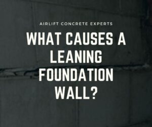 what causes a leaning foundation wall