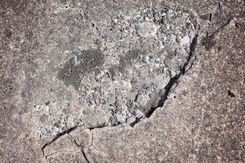 A crack in a concrete slab is shown