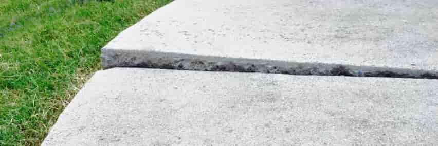 uneven and lifted concrete sidewalk