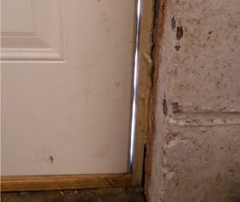 gap in door frame caused by settling foundation