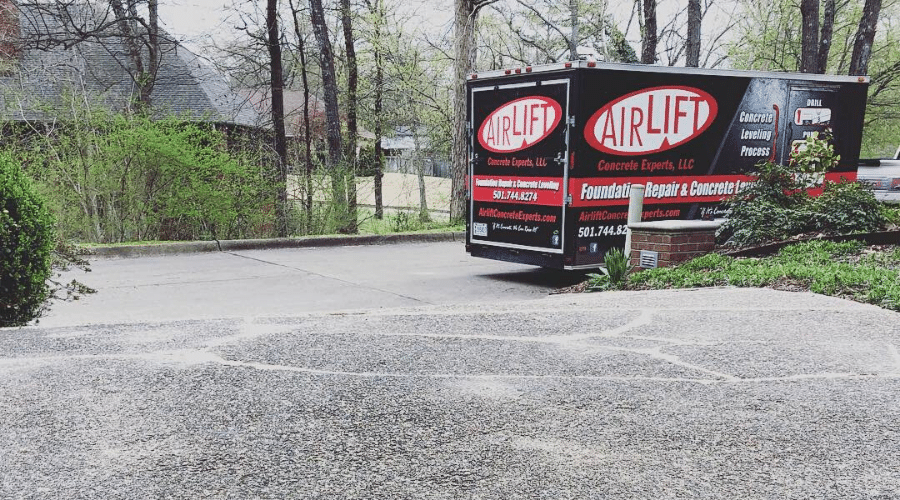 The Airlift Concrete Experts trailer at a concrete repair project.